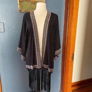 Anthropologie kimono cape with hanging bottom macrame fringe.